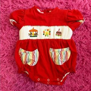 Red baby bubble with smocked fair design